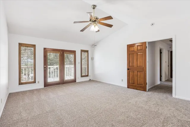 a view of a room that has a large window