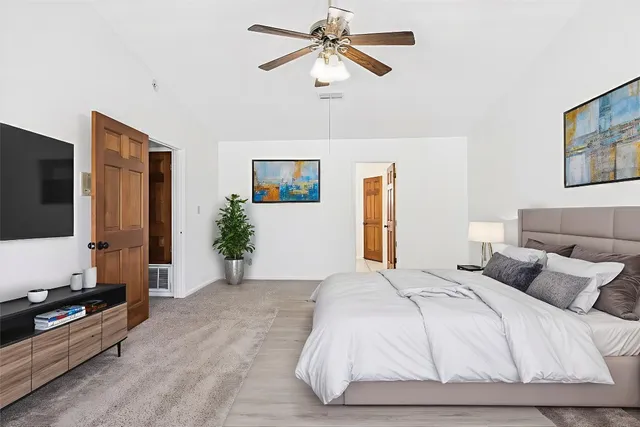 a view of a deck with two chairs and wooden floor