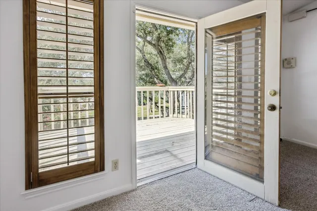 a spacious bathroom with stainless steel appliances a sink and a mirror