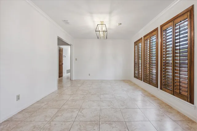 a kitchen with sink and cabinets