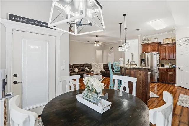 a living room with lots of furniture and kitchen view
