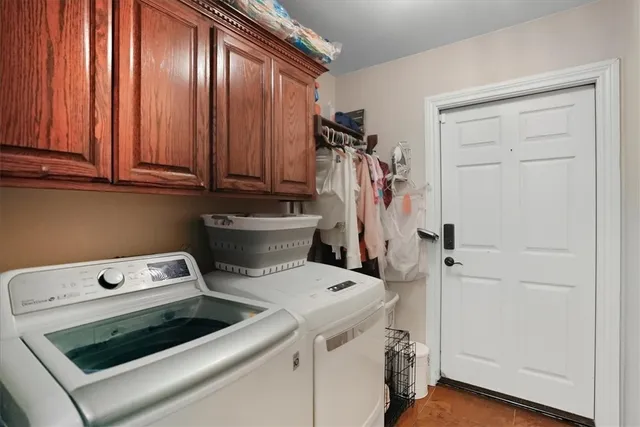 a view of storage and utility room with washer and dryer