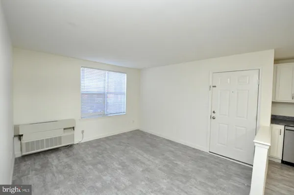 a view of an empty room and entryway