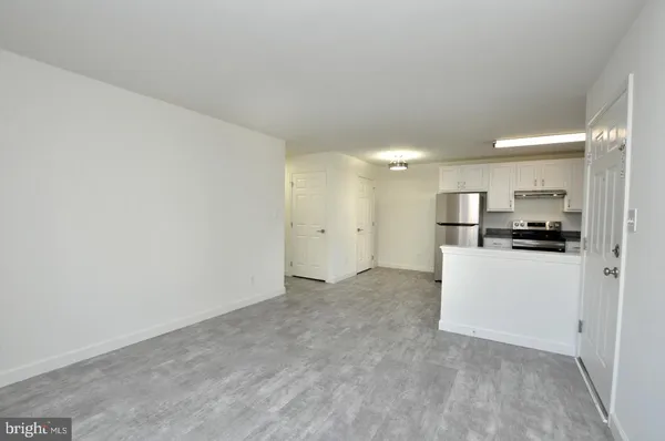 a view of kitchen with refrigerator sink and microwave