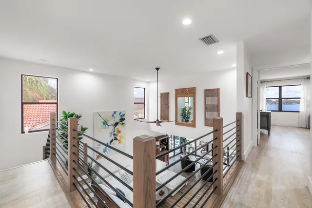 a very nice looking room with a large window and furniture