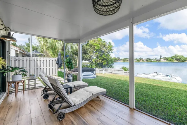 a view of backyard with a patio and outdoor seating