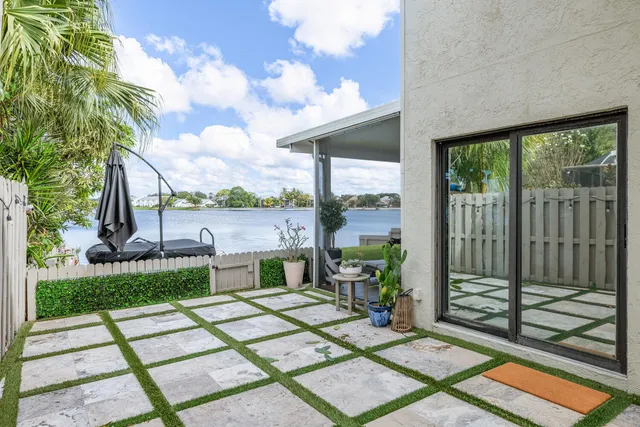 a view of a patio with two chairs and a table