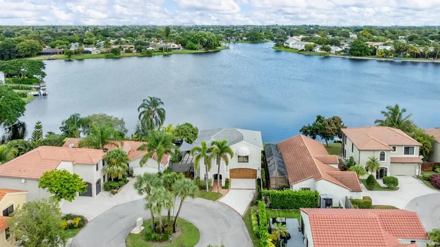 a view of a lake with houses in the back