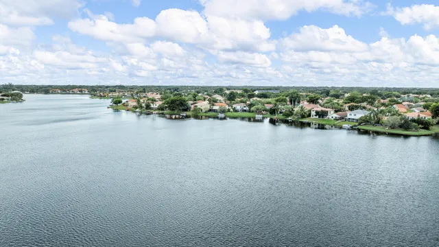 a view of a lake with houses in the back