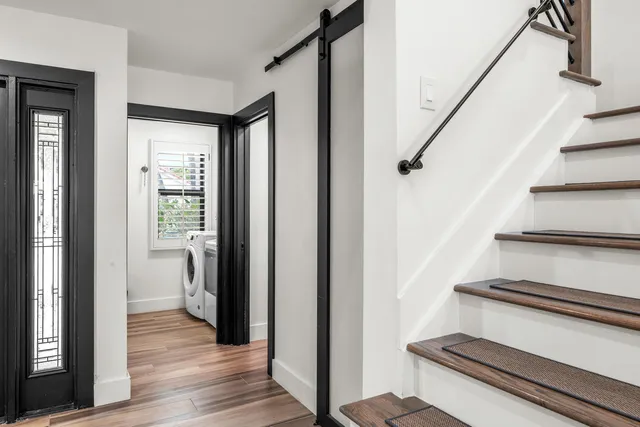 a bathroom with a toilet a sink and a mirror