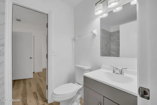 a bathroom with a shower and a sink