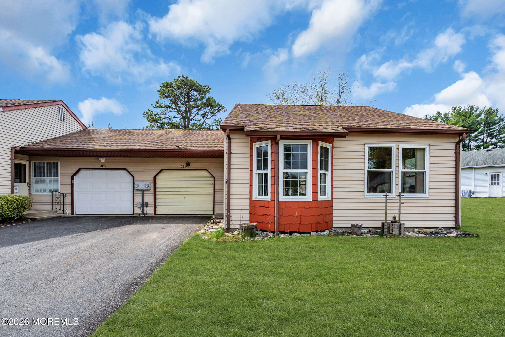 20B Amesbury Road, Unit B Whiting, NJ 08759 - Photo 1 of 25 a front view of a house with a garden and yard