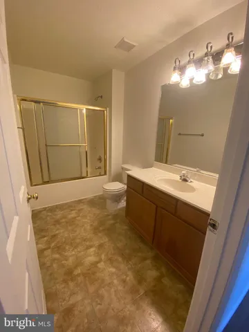 a bathroom with a sink a vanity and mirror