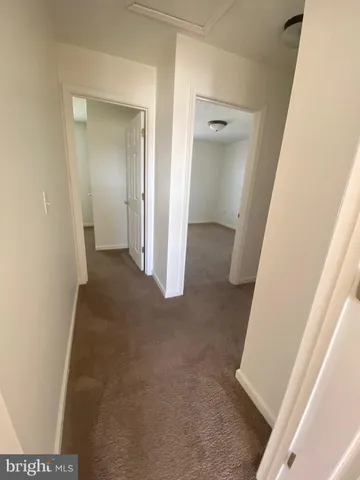 a view of a hallway view with staircase