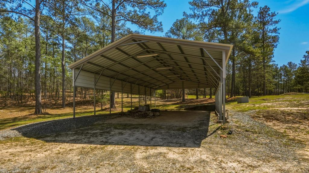 167 Lambert Lake Estates Box Springs, GA 31801 - Photo 62 of 70 12 ft tall RV/boat detached carport