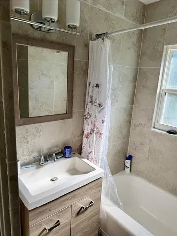a bathroom with a sink and a bathtub