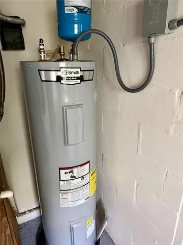 a bathroom with a sink mirror and toilet