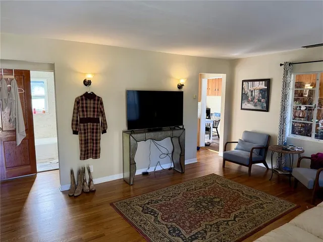 a living room with furniture rug and window