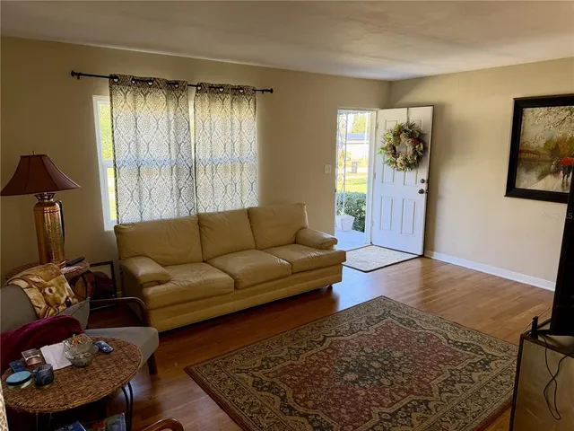 a living room with furniture and a window