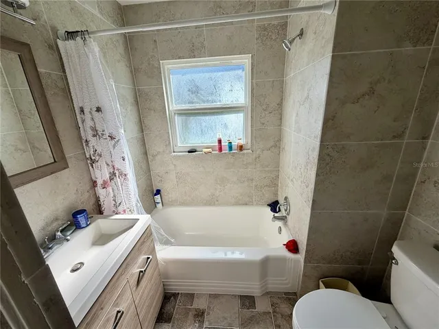 a bathroom with a sink a toilet and a bathtub