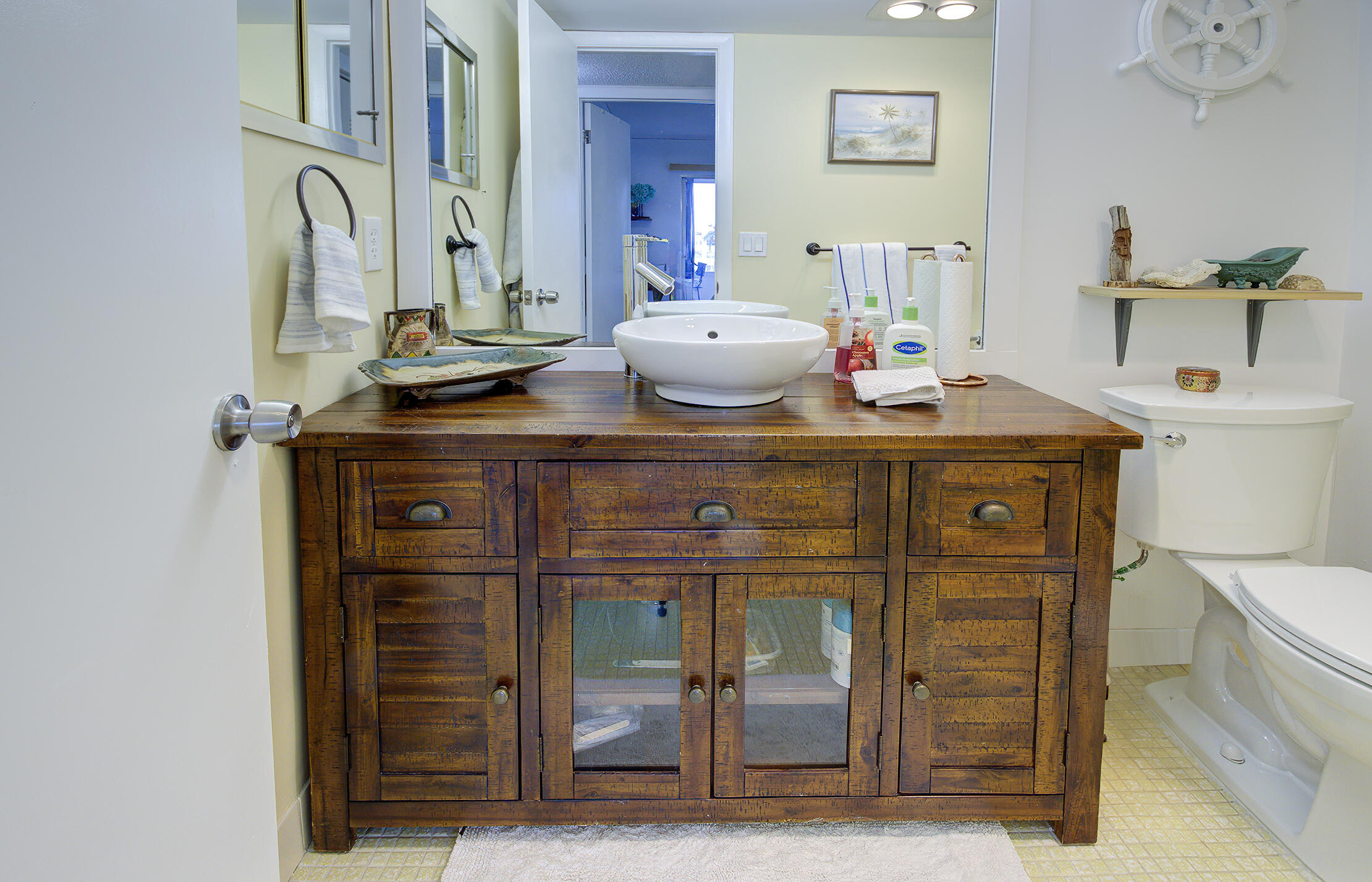 363 Wellington J West Palm Beach, FL 33417 - Photo 13 of 17 a bathroom with a sink and a mirror