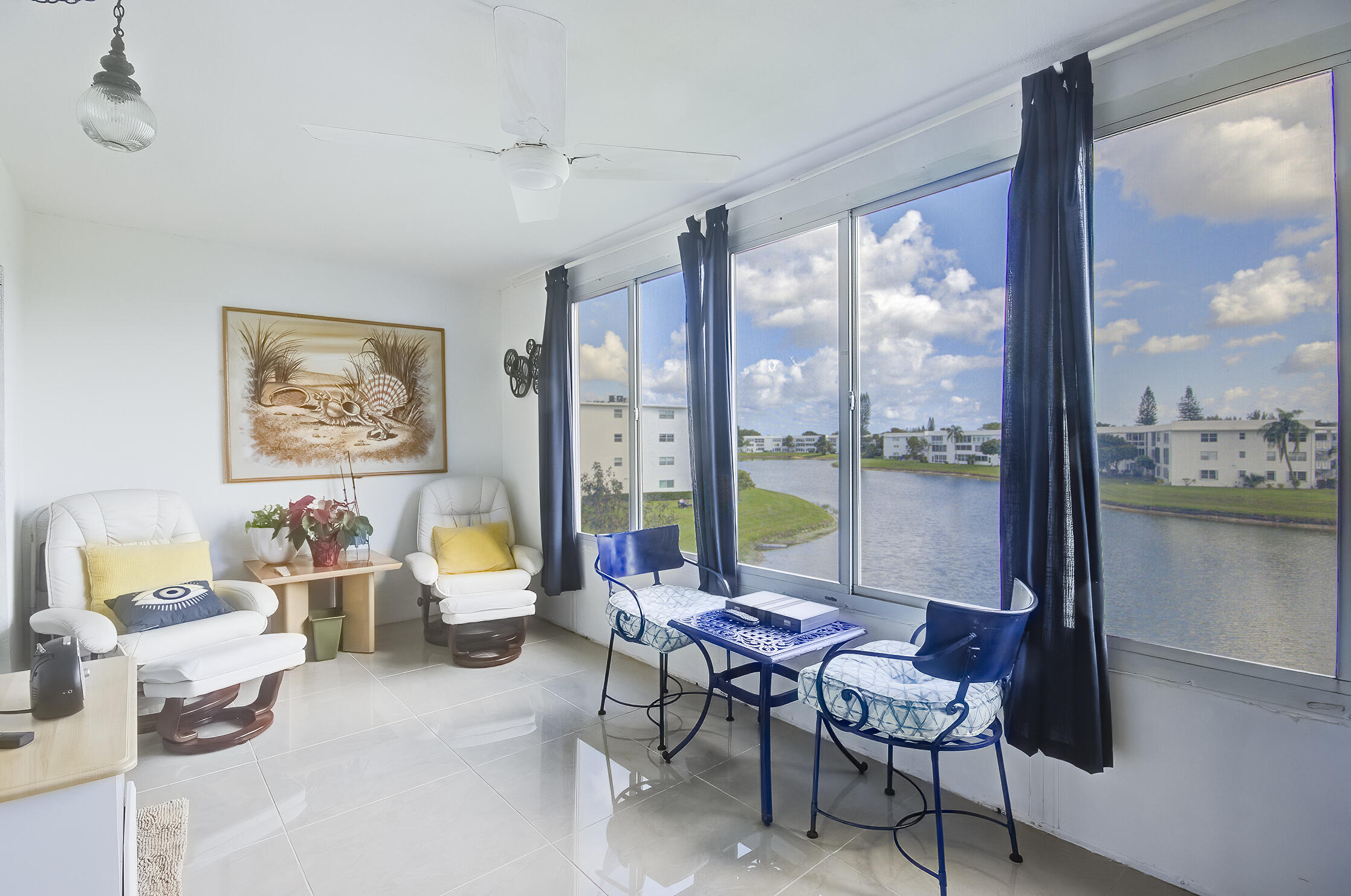 363 Wellington J West Palm Beach, FL 33417 - Photo 14 of 17 a living room with furniture and a floor to ceiling window