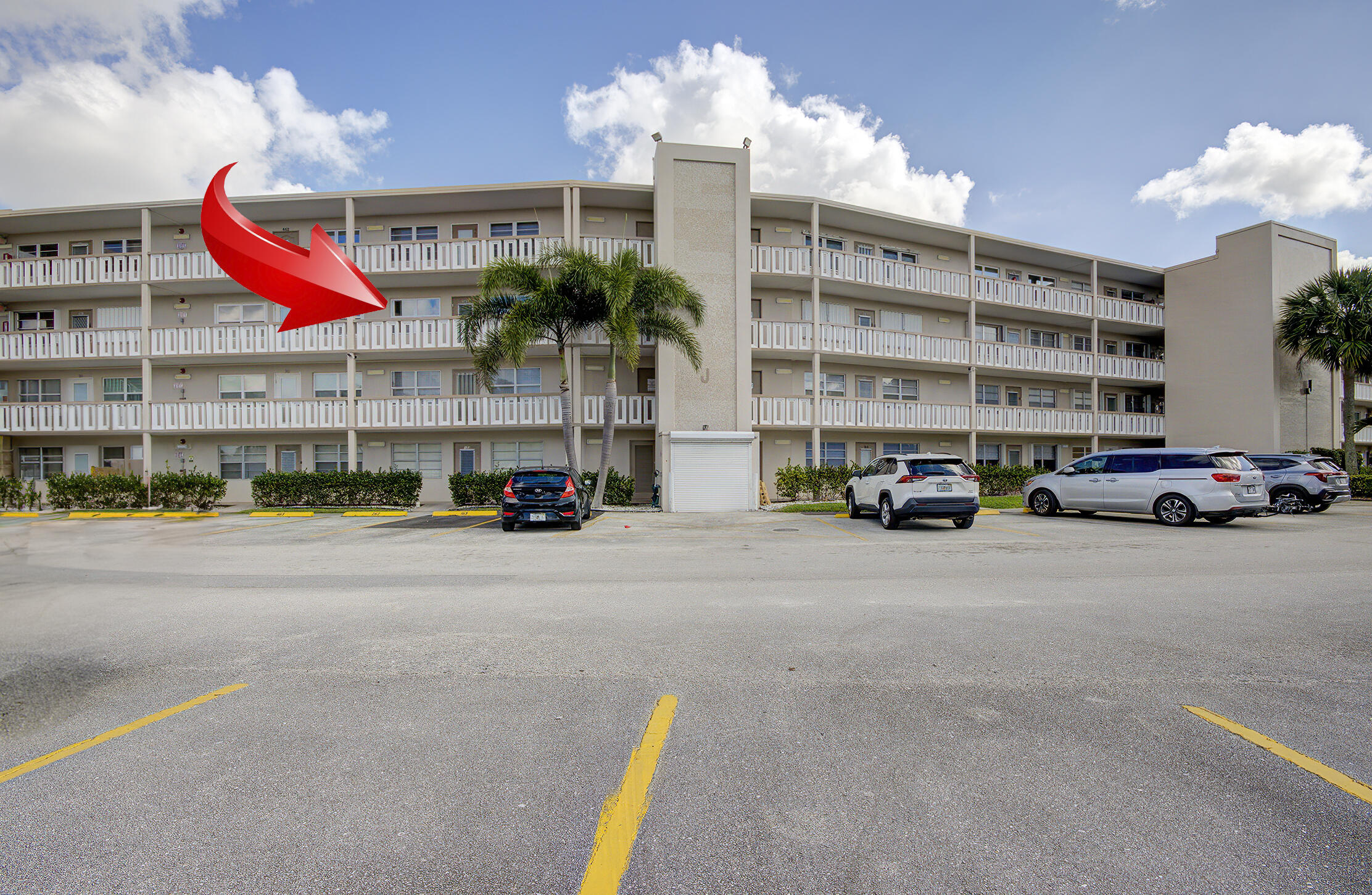 363 Wellington J West Palm Beach, FL 33417 - Photo 17 of 17 a car parked in front of a building
