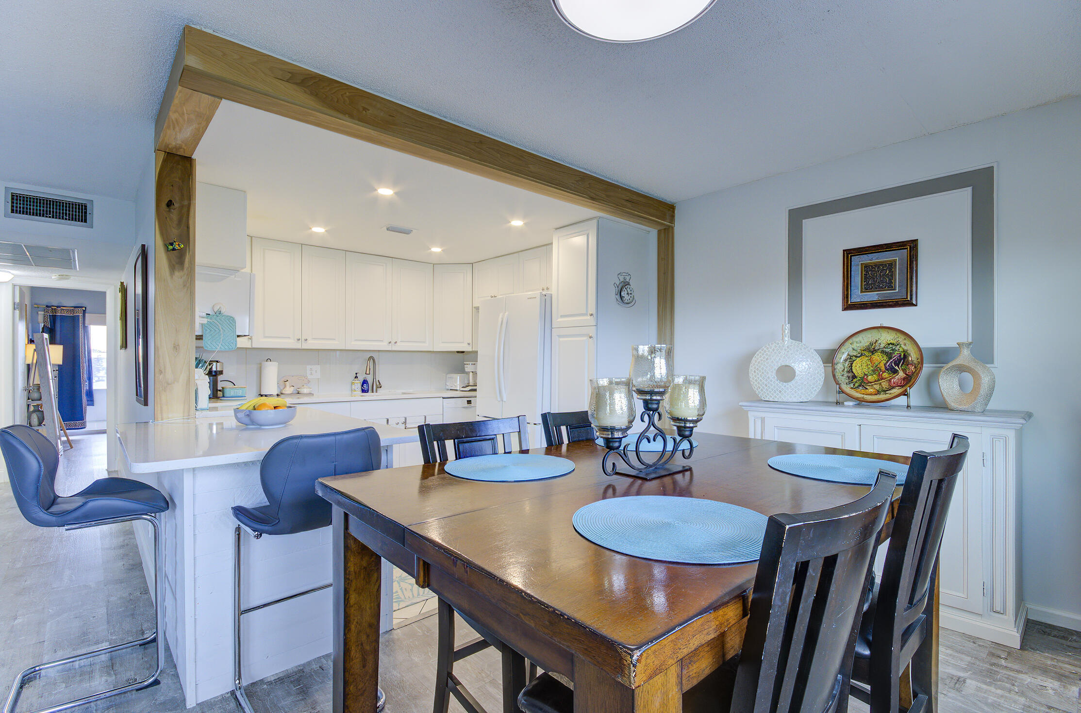 363 Wellington J West Palm Beach, FL 33417 - Photo 4 of 17 a view of a dining room with furniture and wooden floor