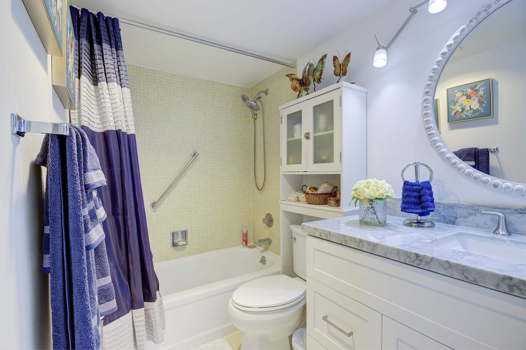 363 Wellington J West Palm Beach, FL 33417 - Photo 9 of 17 a bathroom with a granite countertop sink toilet and shower