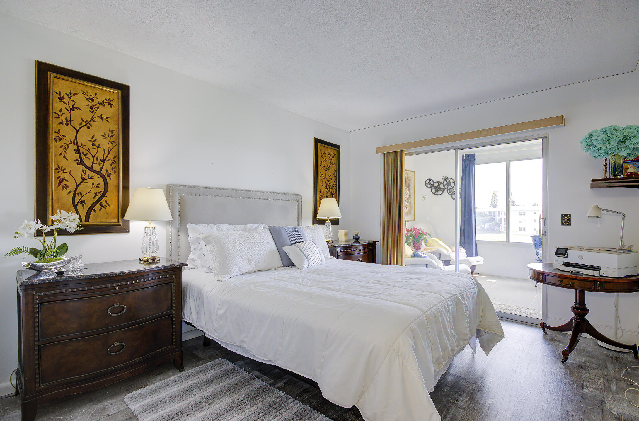 363 Wellington J West Palm Beach, FL 33417 - Photo 10 of 17 a bedroom with a bed and a window