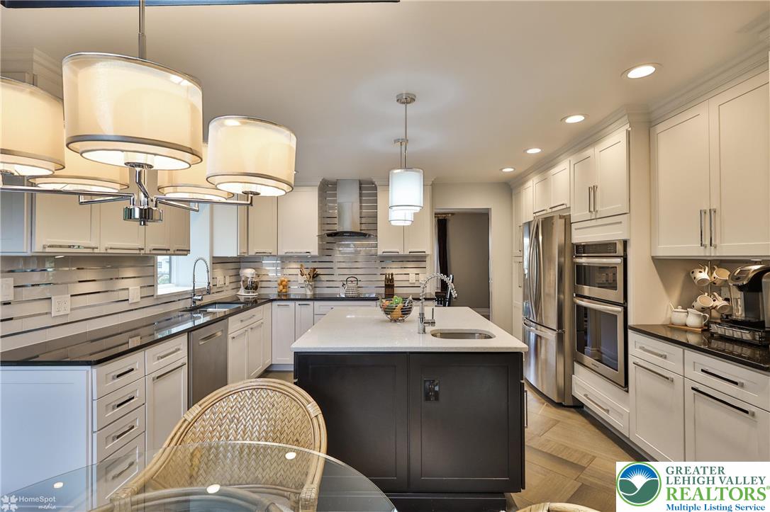 2821 Center Street Bethlehem, PA 18017 - Photo 9 of 58 High end appliances, granite and quartz countertops, under cabinet lighting, tile backsplash w/ stainless steel accents