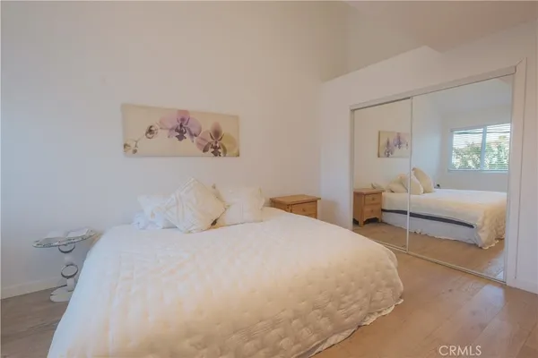 a bedroom with a bed and a couch