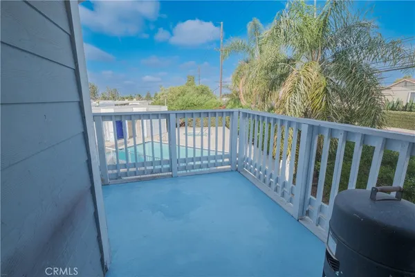 a view of a balcony with wooden fence