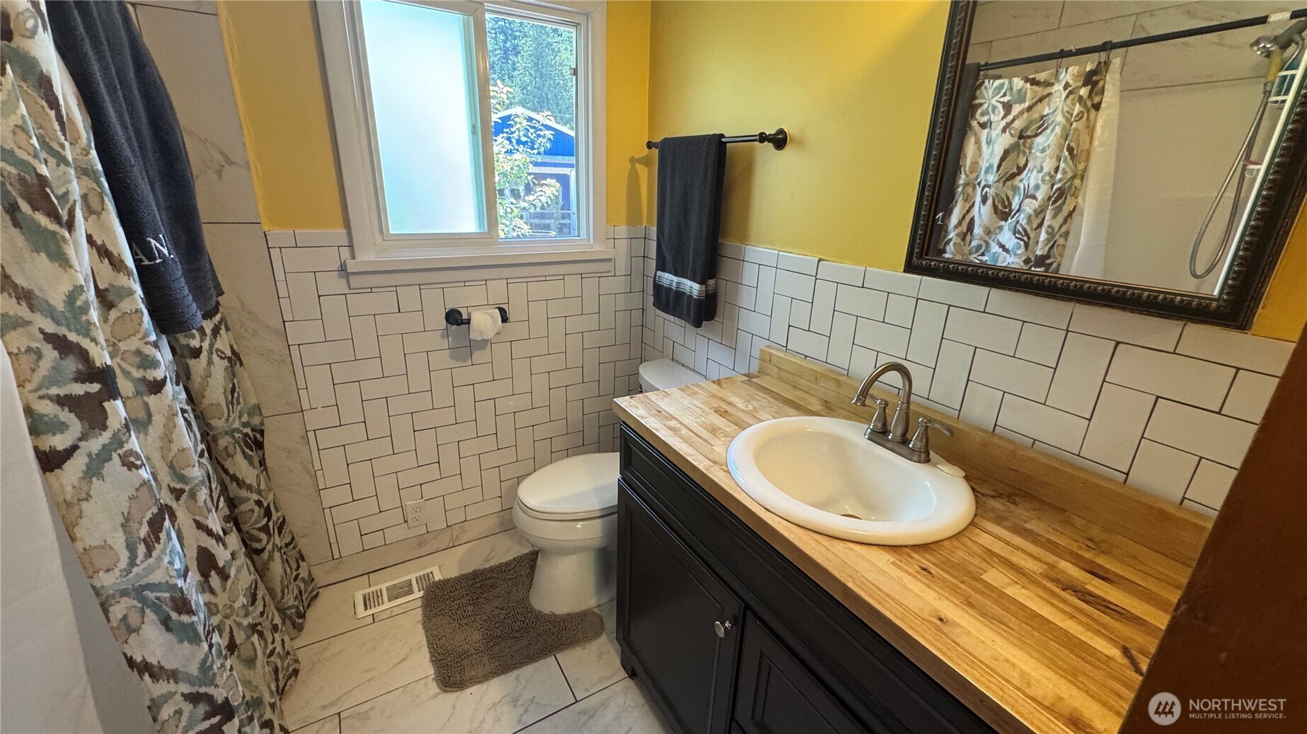 1245 West Axton Road Ferndale, WA 98248 - Photo 14 of 30 a bathroom with a granite countertop sink toilet and mirror