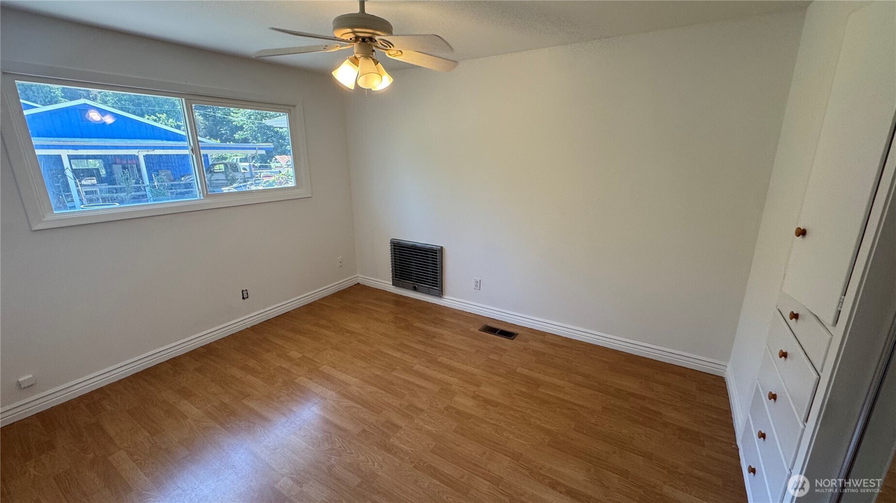 1245 West Axton Road Ferndale, WA 98248 - Photo 15 of 30 a view of empty room with wooden floor and fan