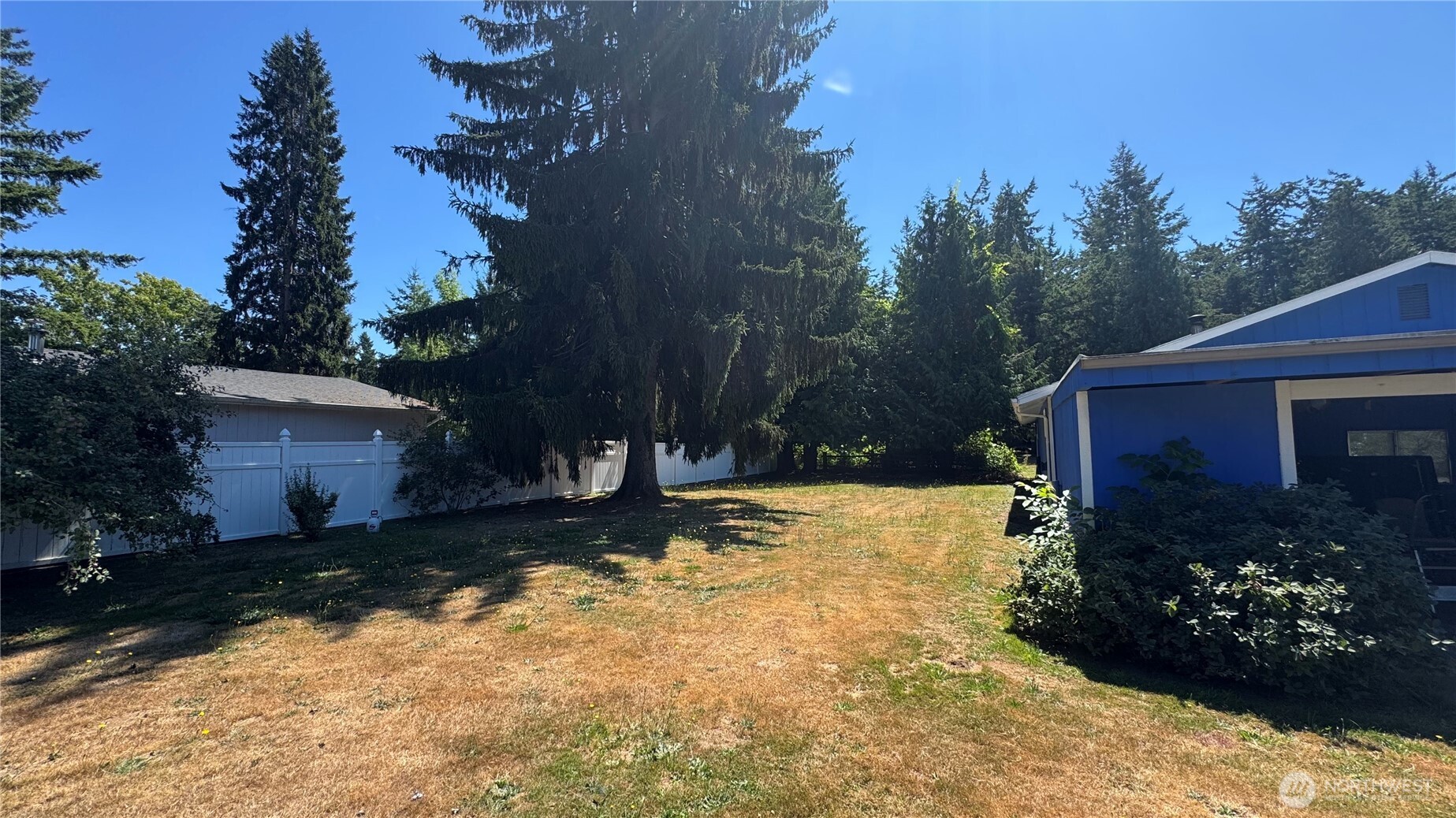 1245 West Axton Road Ferndale, WA 98248 - Photo 28 of 30 a view of a yard with a house in the background
