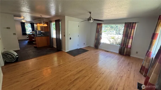 a view of livingroom with furniture and a window