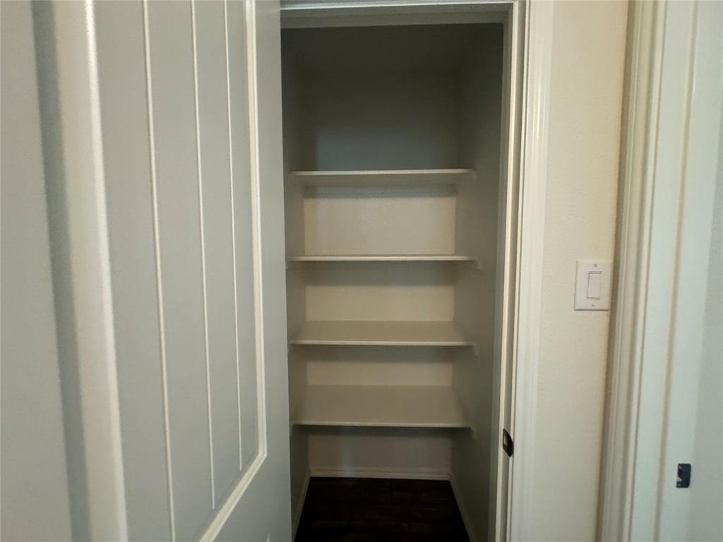 4700 Essonite Road Little Elm, TX 76227 - Photo 24 of 37 a view of walk in closet with empty racks