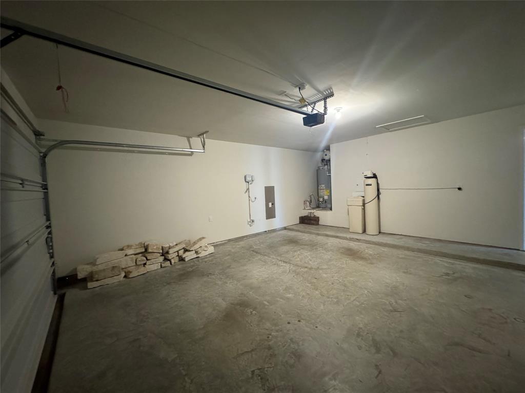 4700 Essonite Road Little Elm, TX 76227 - Photo 34 of 34 Sprinkler system and water heater in Garage