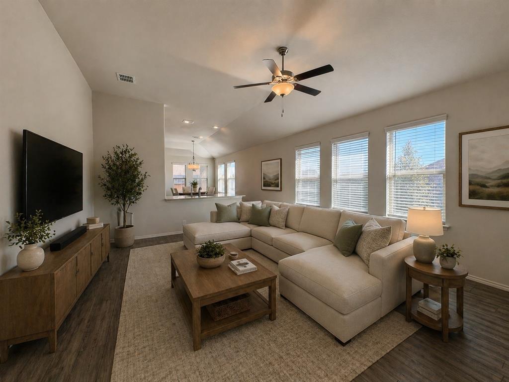 4700 Essonite Road Little Elm, TX 76227 - Photo 6 of 37 a living room with furniture and a flat screen tv