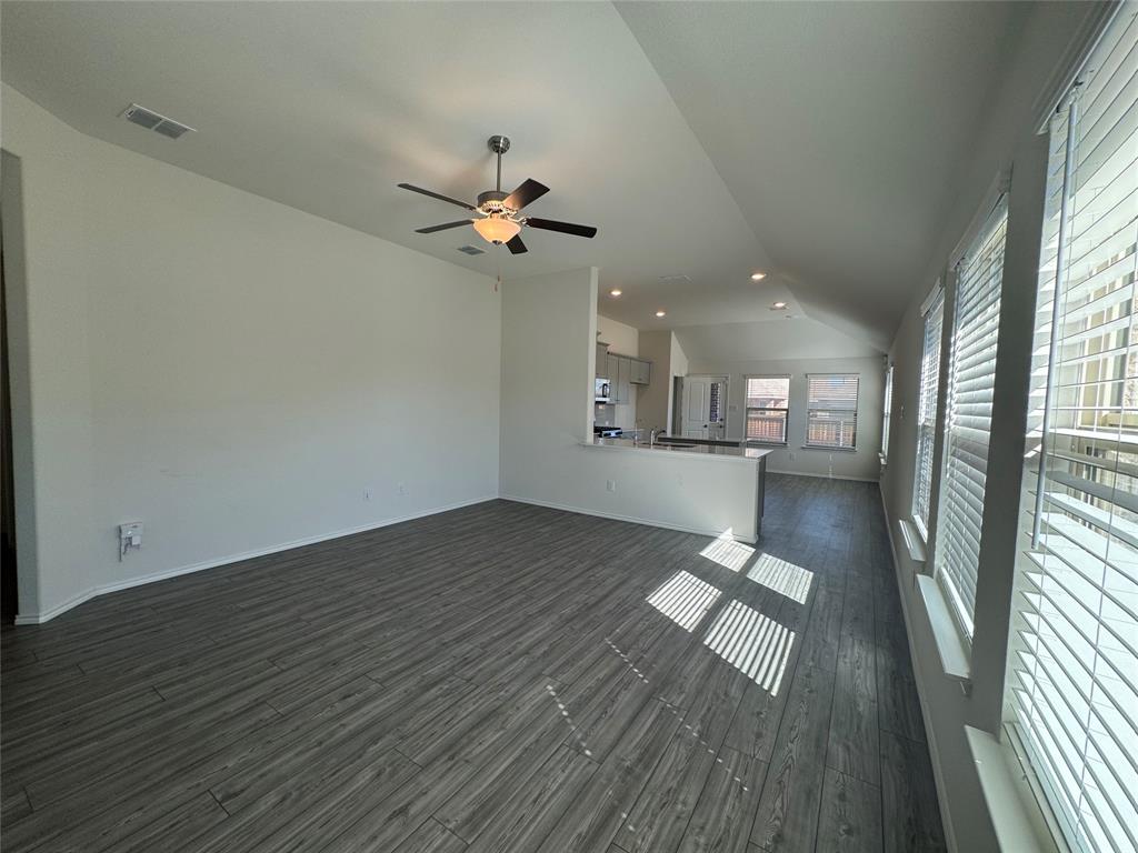 4700 Essonite Road Little Elm, TX 76227 - Photo 7 of 37 wooden floor in an empty room with a window