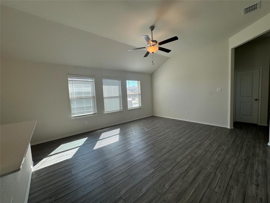 4700 Essonite Road Little Elm, TX 76227 - Photo 9 of 37 a view of empty room with wooden floor and fan