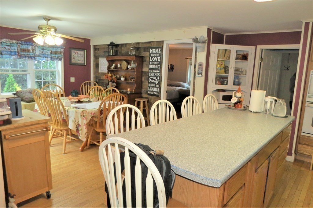 114 North Main Street Salem, NH 03079 - Photo 5 of 26 a view of a dining room with furniture window and outside view