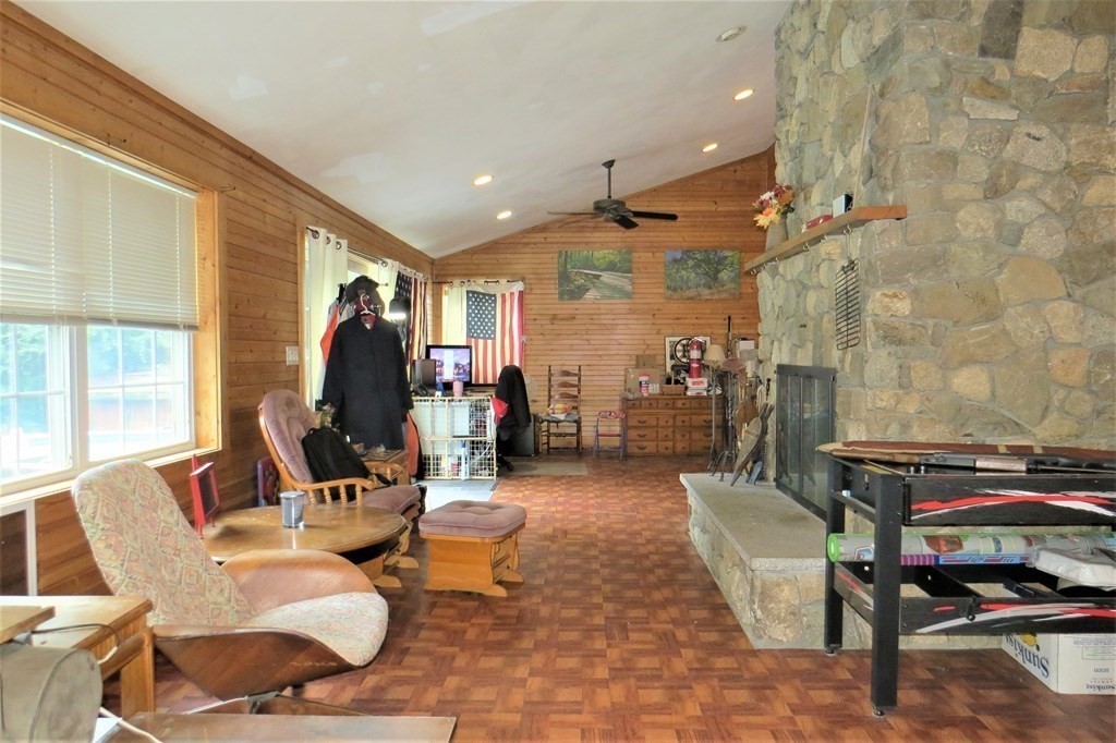 114 North Main Street Salem, NH 03079 - Photo 10 of 26 a living room with furniture a rug and a window