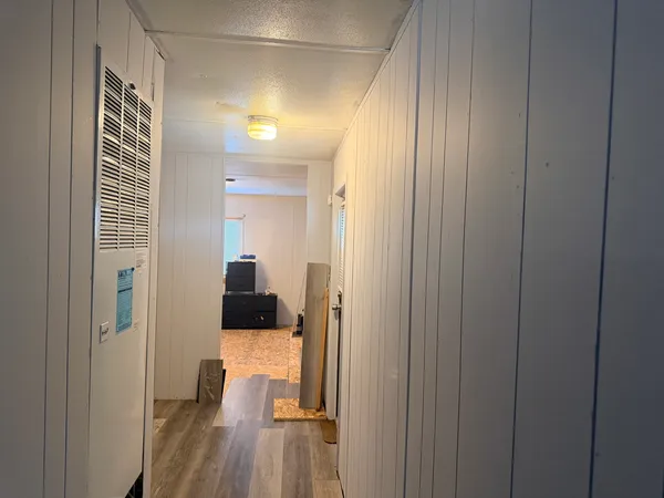 a view of a bedroom from a hallway