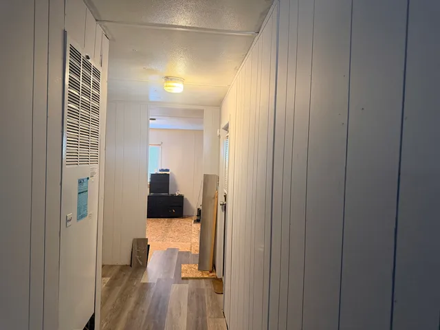 a view of a bedroom from a hallway