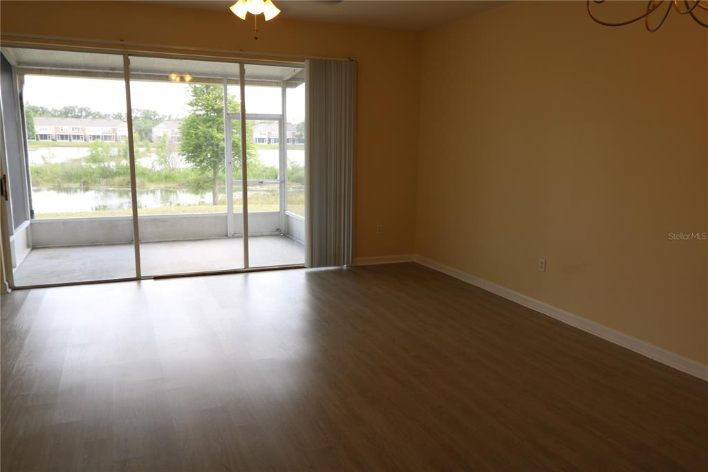 10165 Haverhill Ridge Drive Riverview, FL 33578 - Photo 13 of 33 wooden floor in an empty room with a window