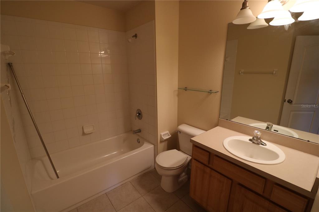 10165 Haverhill Ridge Drive Riverview, FL 33578 - Photo 28 of 33 a bathroom with a sink a toilet and shower