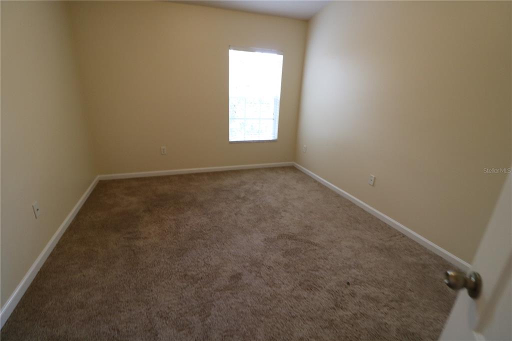 10165 Haverhill Ridge Drive Riverview, FL 33578 - Photo 30 of 33 an empty room with a window