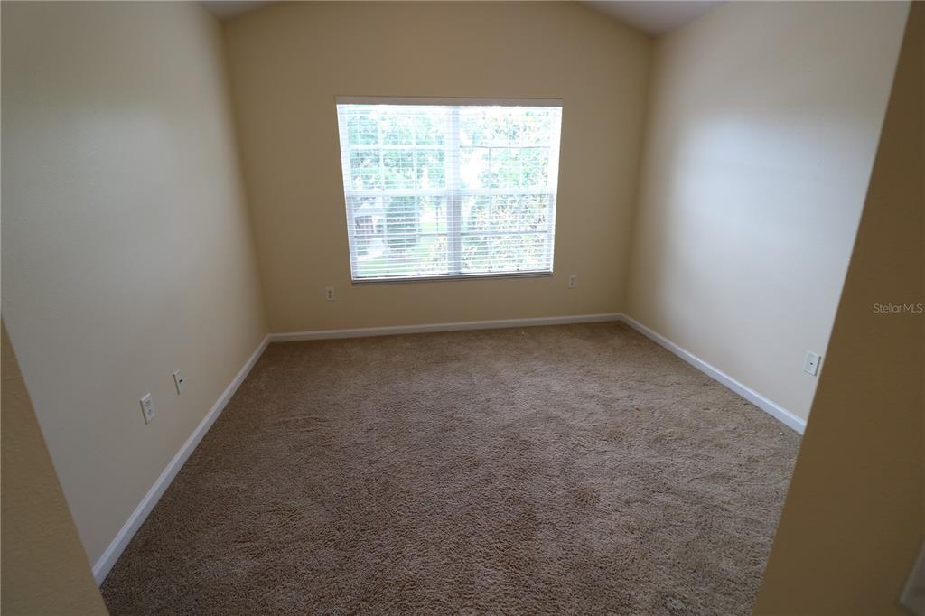 10165 Haverhill Ridge Drive Riverview, FL 33578 - Photo 32 of 33 an empty room with a window